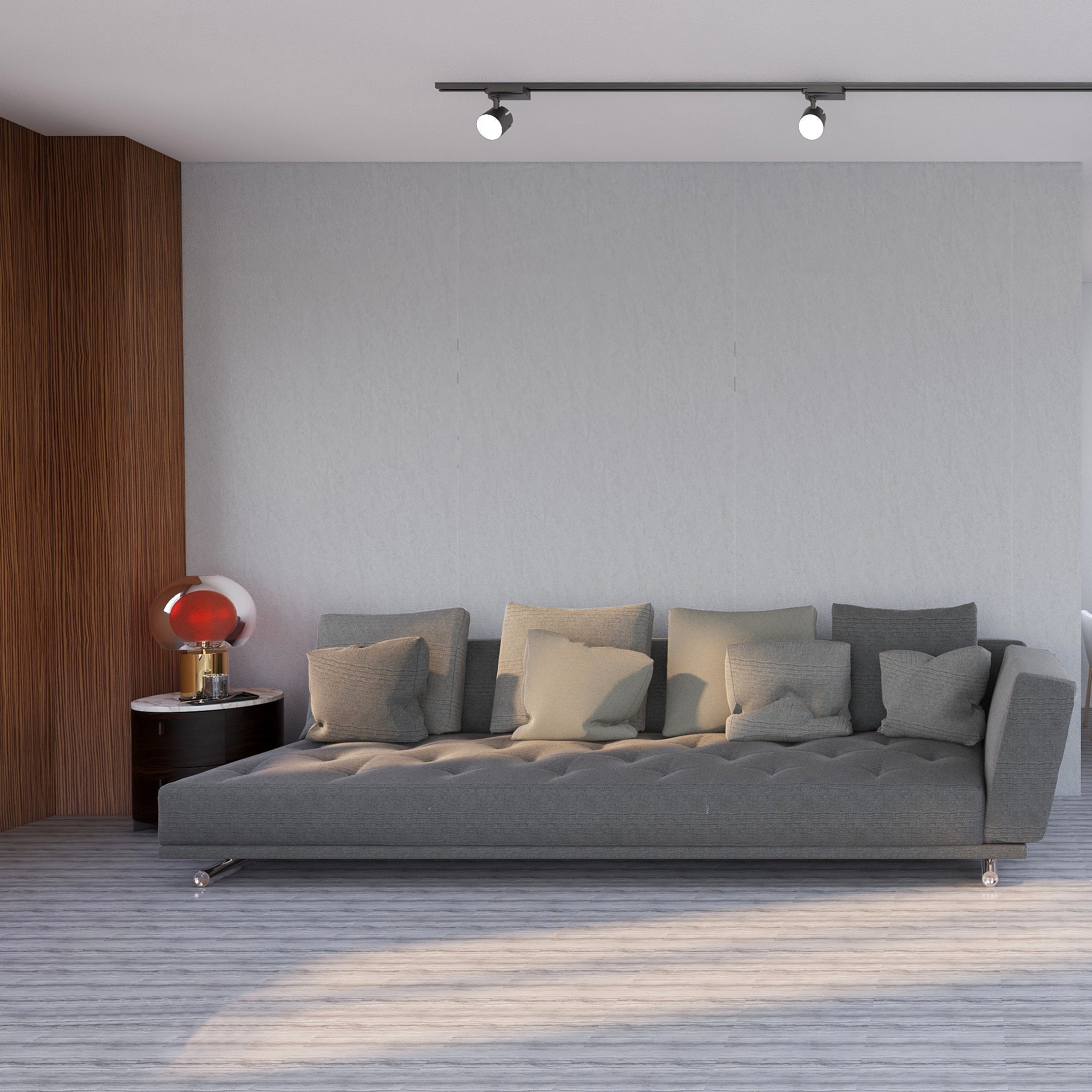 Modern living room with gray sofa, dining table, and chairs.